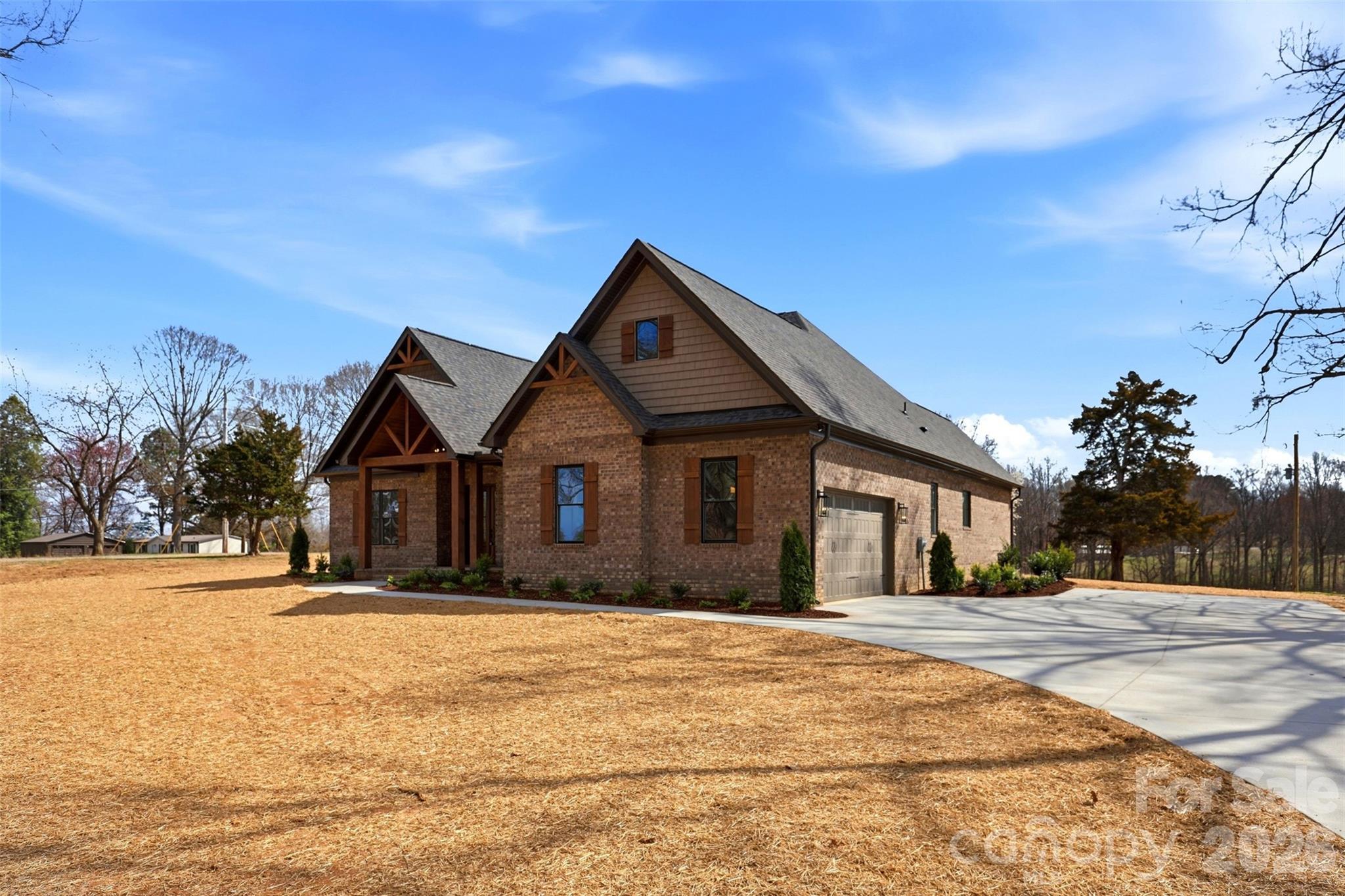 4734 Polk Ford Road Stanfield, NC 28163 - Photo 3 of 48 a front view of a house with a yard