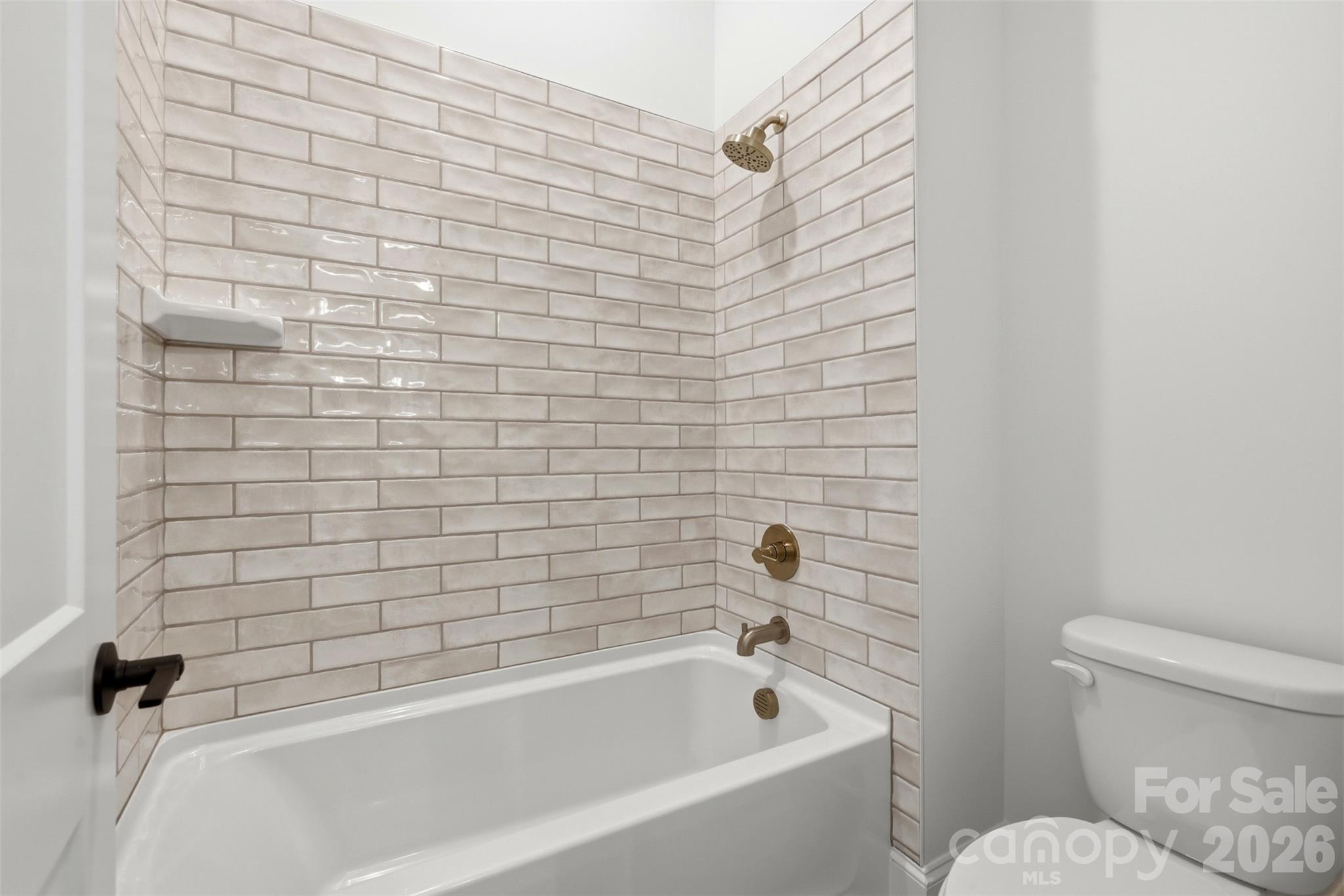 4734 Polk Ford Road Stanfield, NC 28163 - Photo 34 of 48 a bathroom with a toilet and bathtub