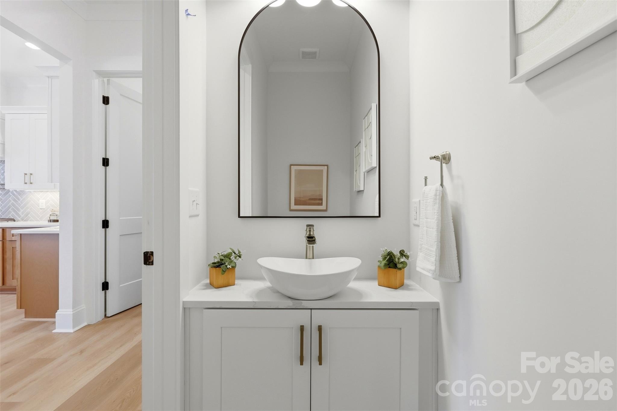 4734 Polk Ford Road Stanfield, NC 28163 - Photo 39 of 48 a bathroom with a sink vanity and a mirror