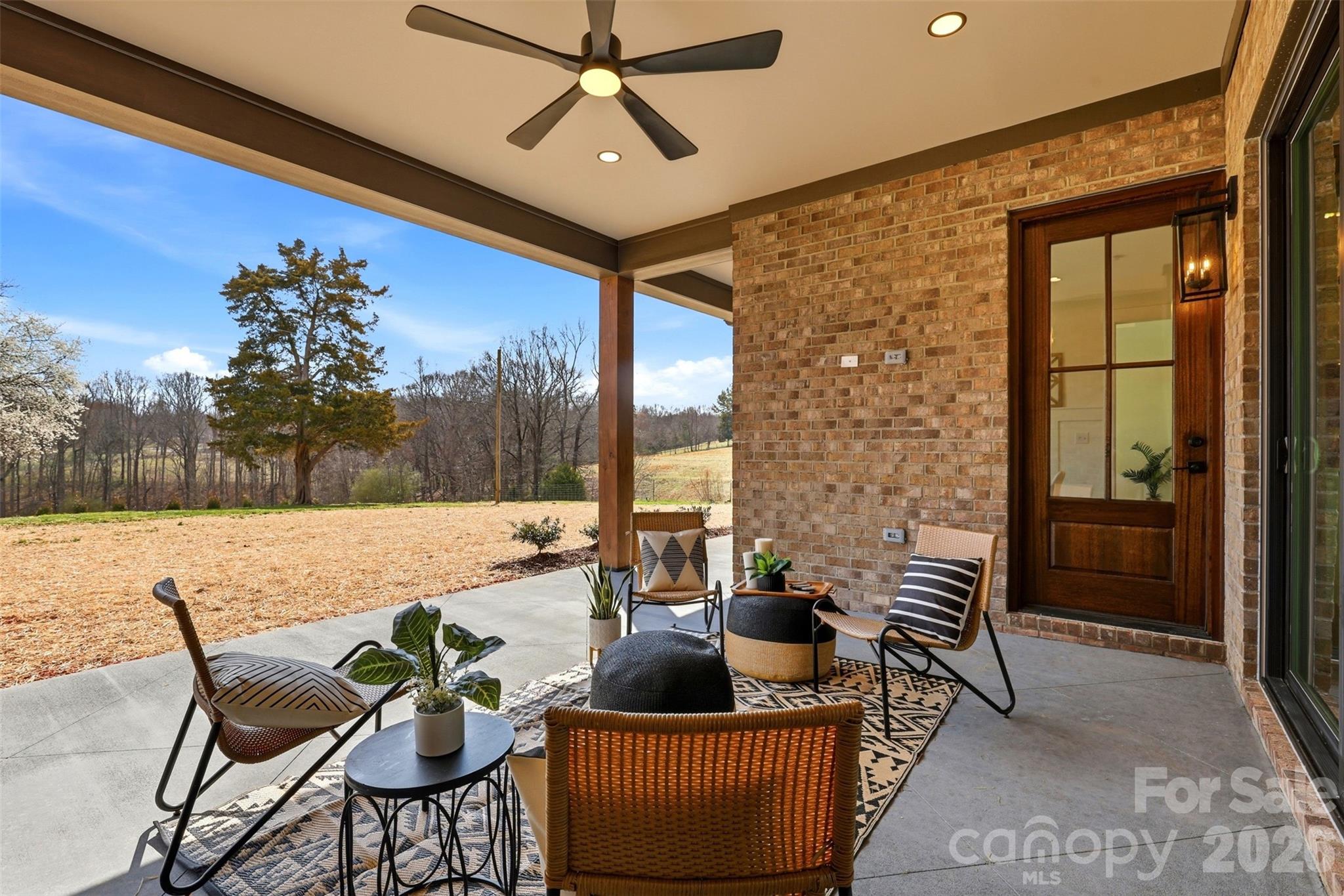 4734 Polk Ford Road Stanfield, NC 28163 - Photo 44 of 48 a outdoor living space with furniture and a potted plant