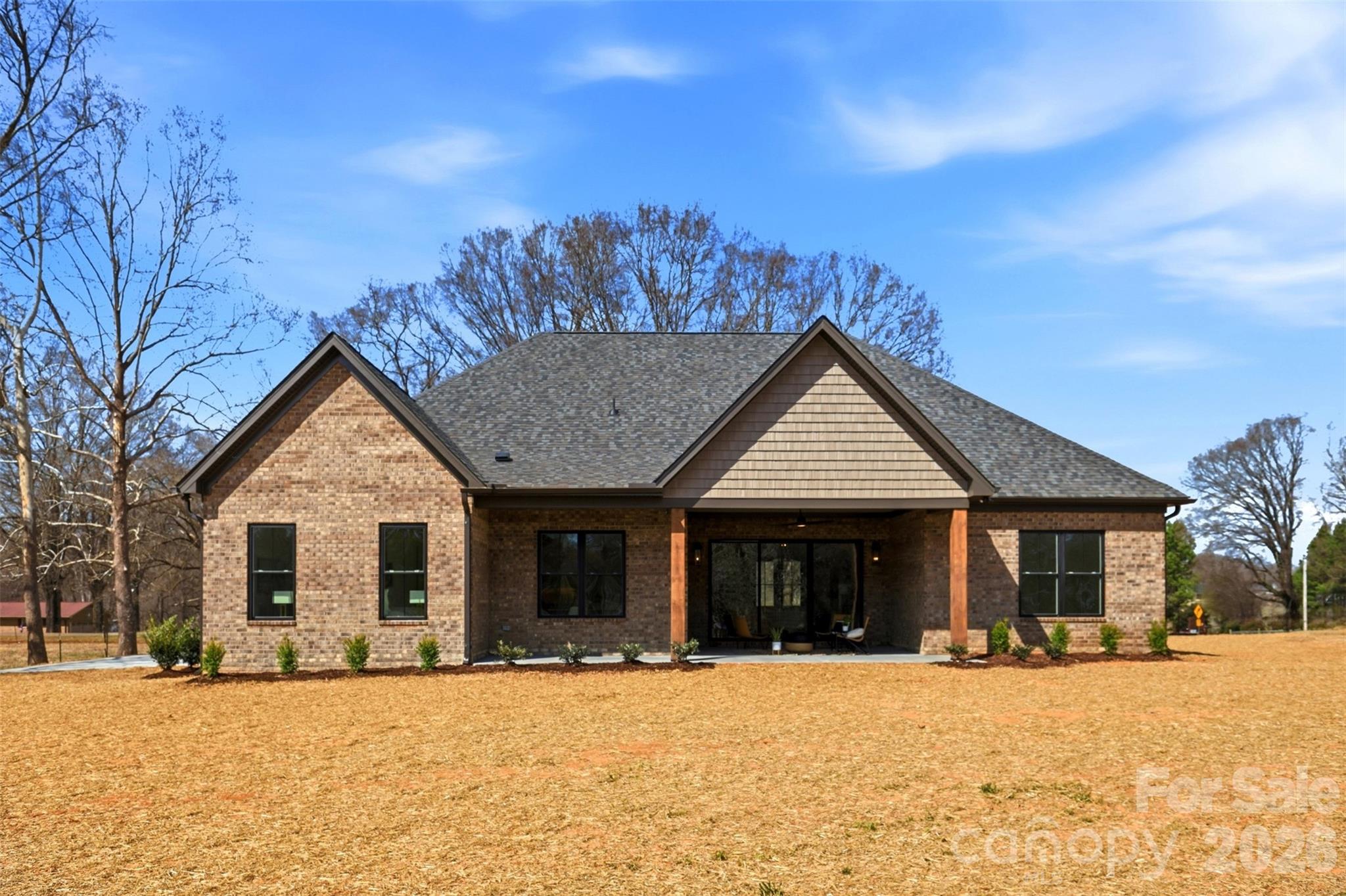 4734 Polk Ford Road Stanfield, NC 28163 - Photo 45 of 48 a front view of a house with a yard covered in snow