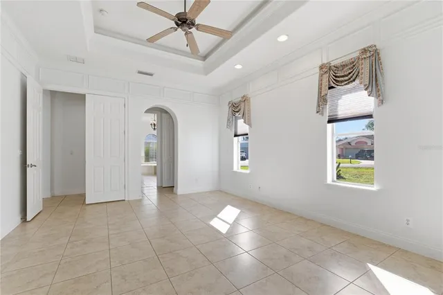 a view of livingroom with workspace and a window
