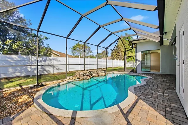 a view of a swimming pool with a lounge chairs