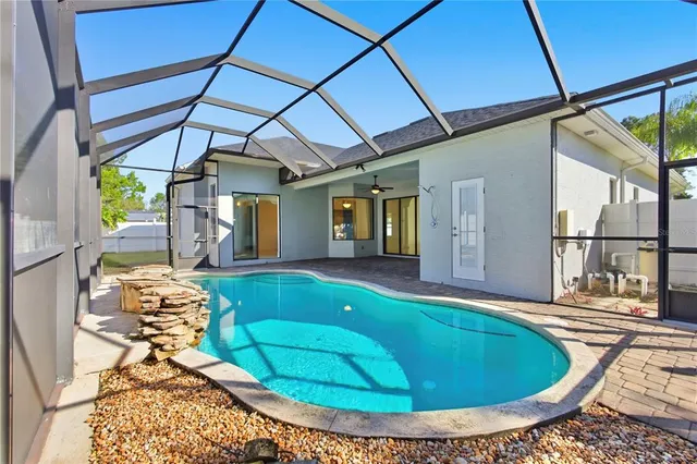 a view of a swimming pool with a lounge chairs