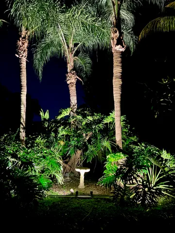 a view of a backyard with sitting area