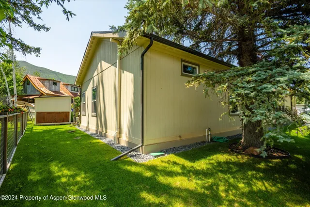 a backyard of a house with lots of green space