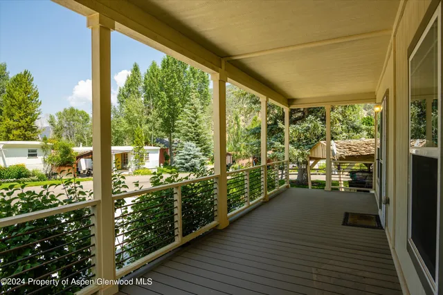a view of a balcony with wooden floor