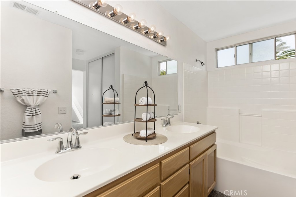 7693 Chanticleer Road Highland, CA 92346 - Photo 11 of 14 a bathroom with a sink and a mirror