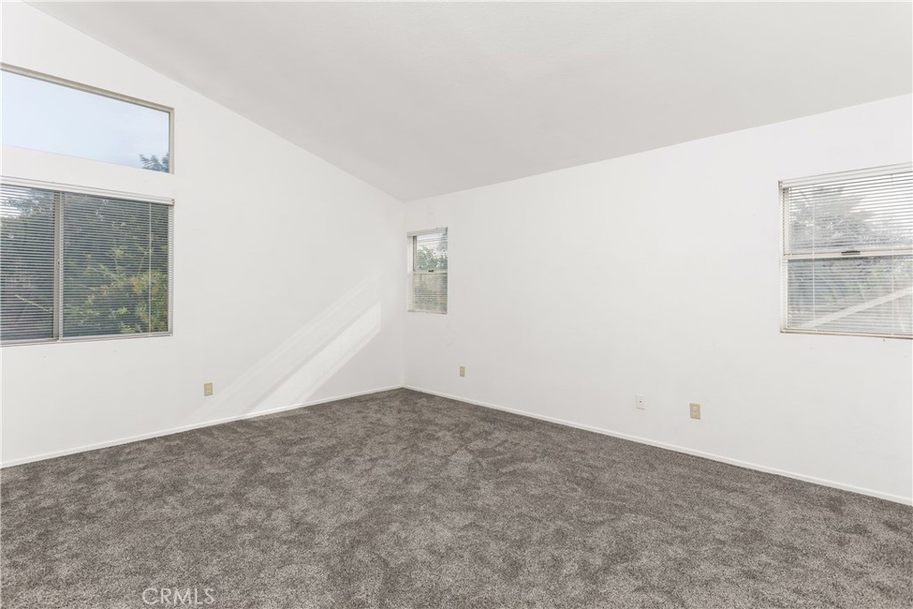 7693 Chanticleer Road Highland, CA 92346 - Photo 10 of 14 an empty room with windows