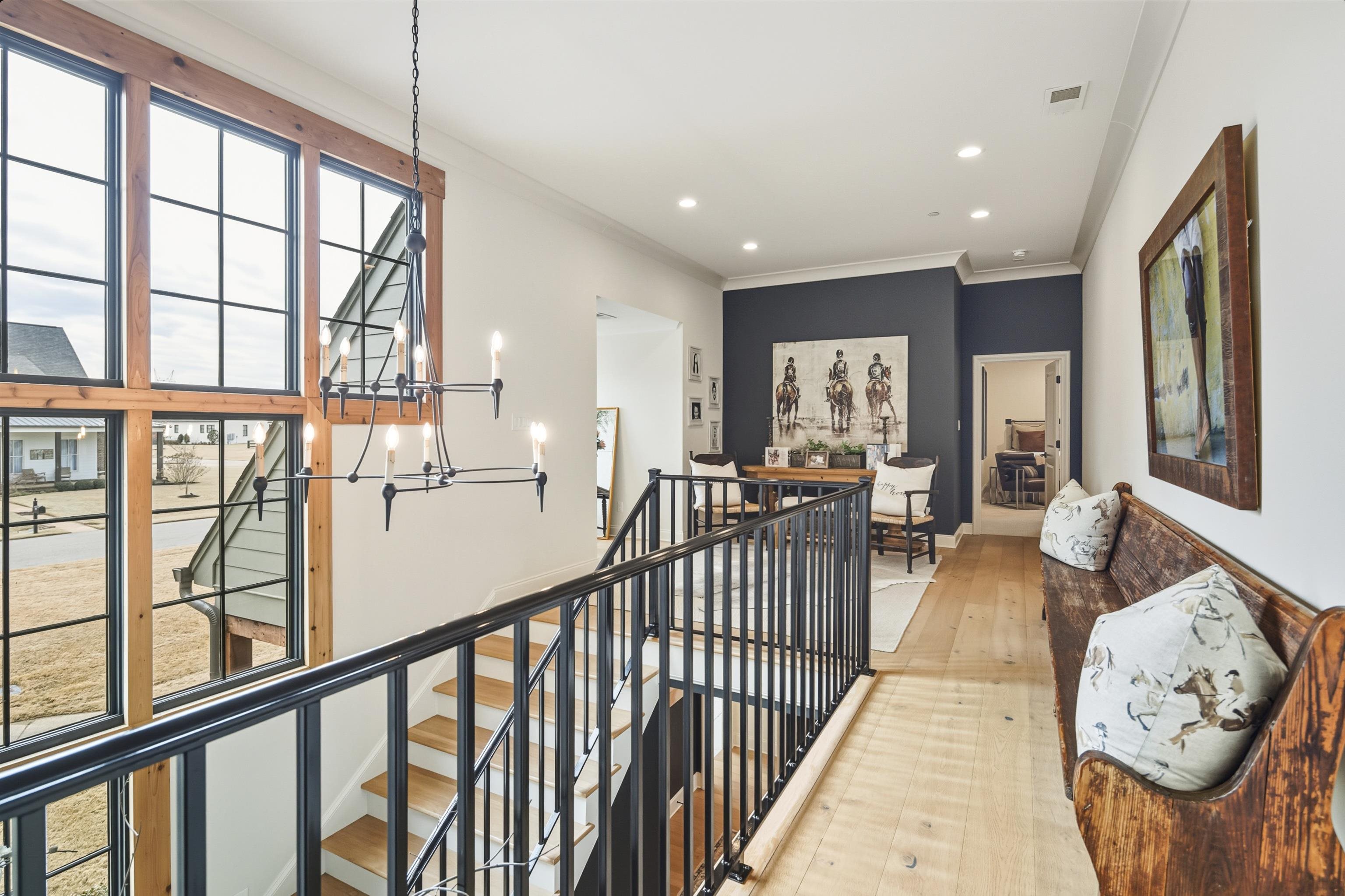160 North Lake Road Piperton, TN 38017 - Photo 1 of 40 Hall featuring an upstairs landing, a chandelier, ornamental molding, light wood finished floors, and recessed lighting