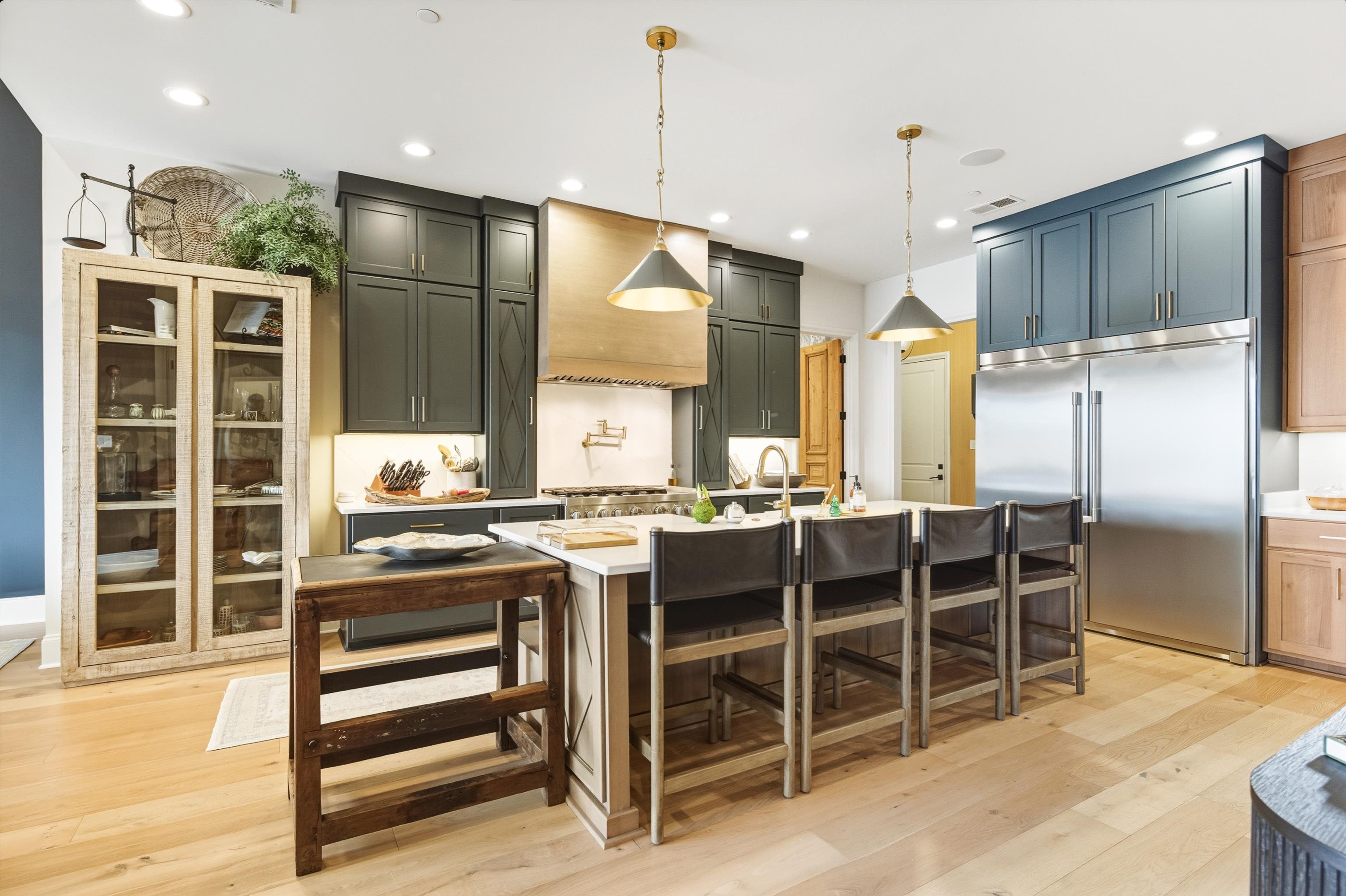 160 North Lake Road Piperton, TN 38017 - Photo 13 of 40 a kitchen with stainless steel appliances kitchen island granite countertop a refrigerator and cabinets