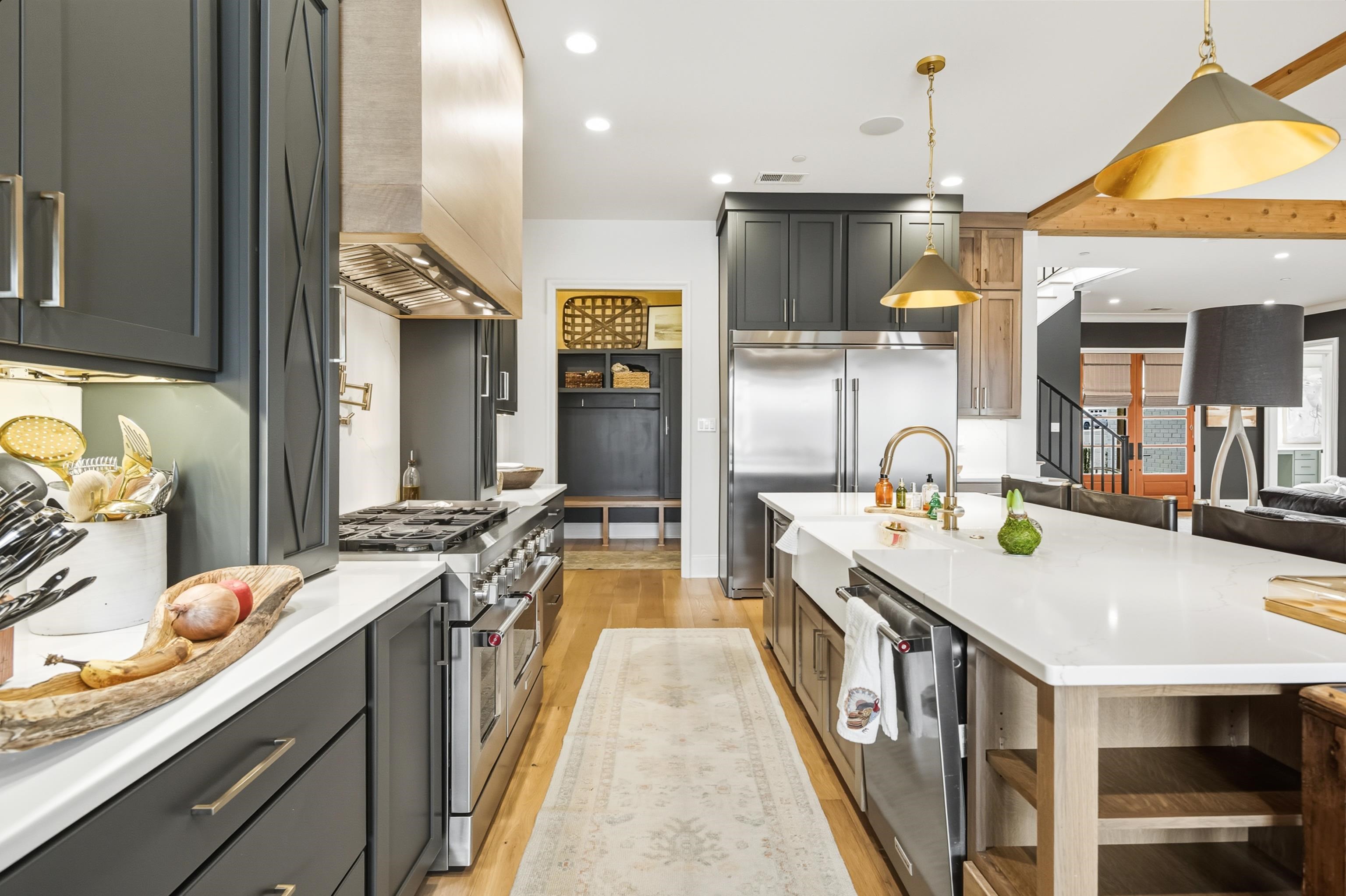 160 North Lake Road Piperton, TN 38017 - Photo 40 of 40 a kitchen with stainless steel appliances a stove a sink dishwasher and a refrigerator with wooden floor