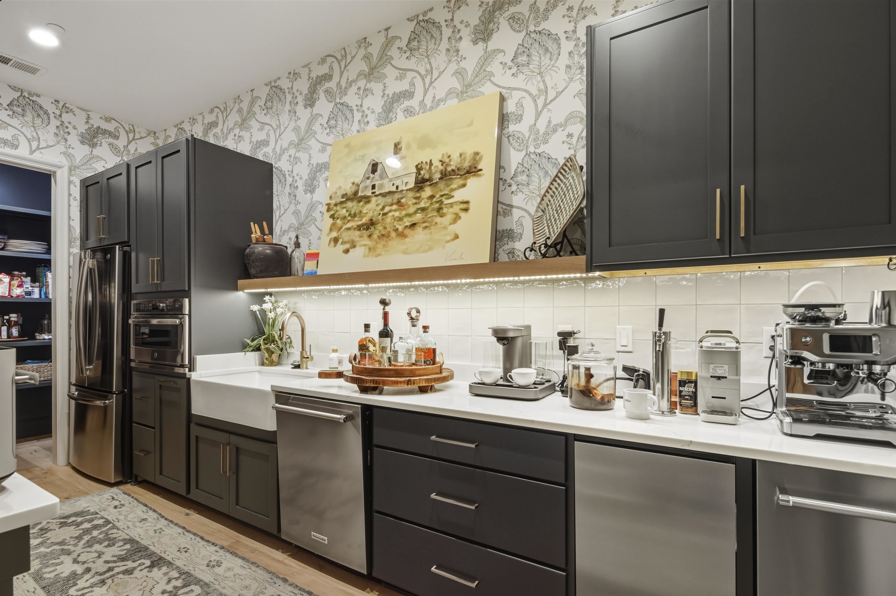 160 North Lake Road Piperton, TN 38017 - Photo 16 of 40 a kitchen with a sink a refrigerator and cabinets