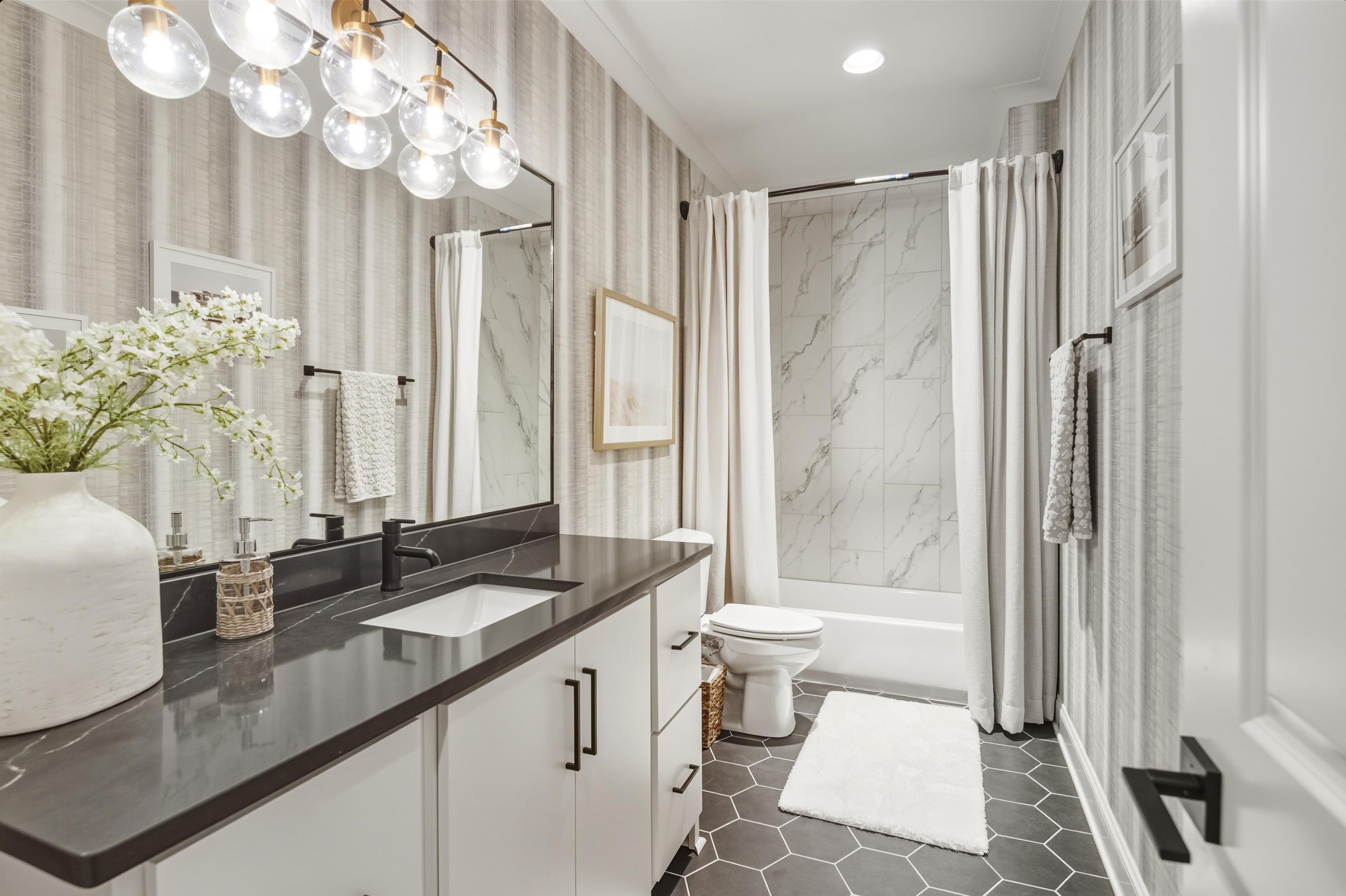 160 North Lake Road Piperton, TN 38017 - Photo 2 of 40 Bathroom featuring shower / bath combination with curtain, wallpapered walls, vanity, and dark tile patterned floors