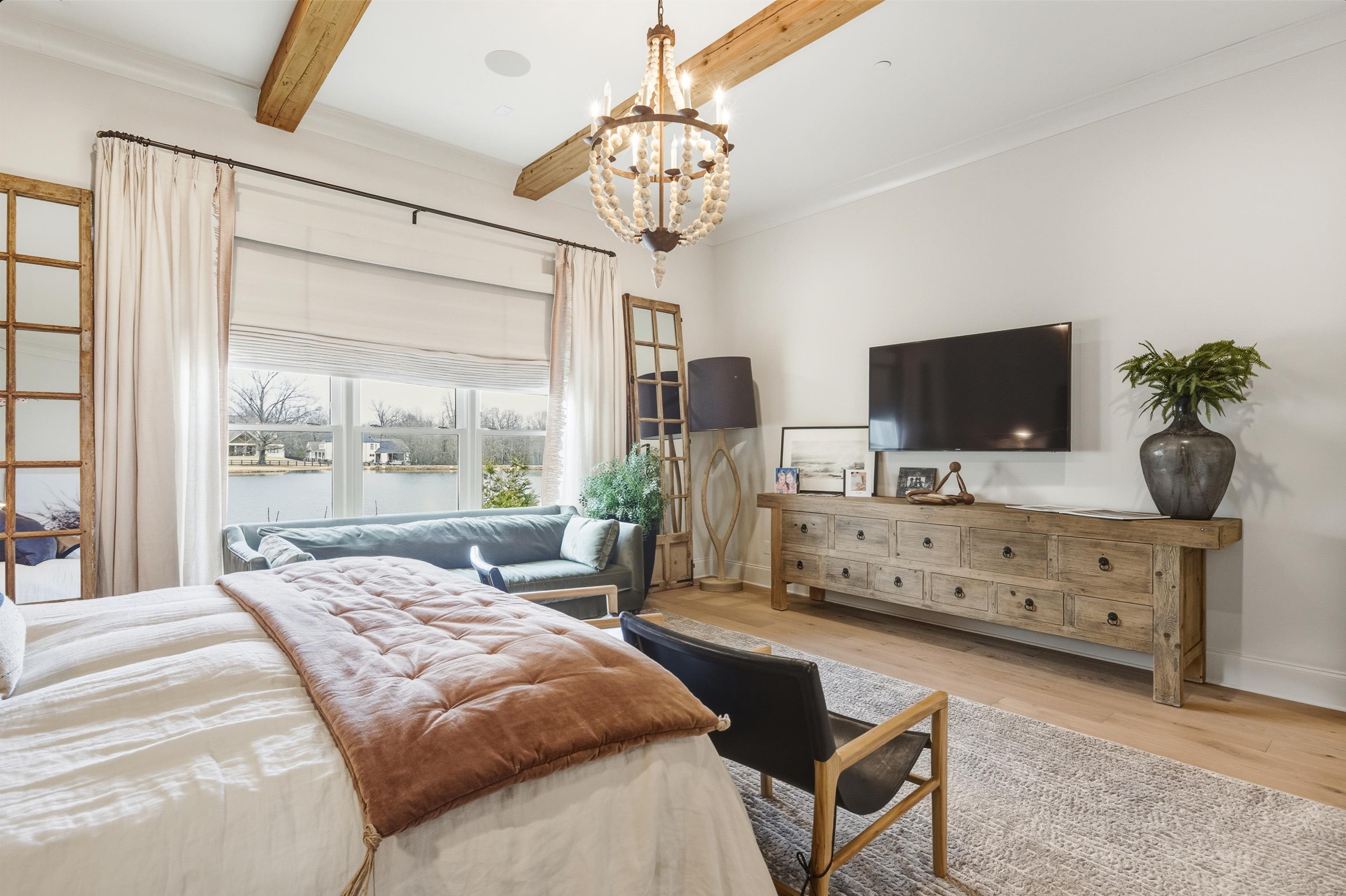 160 North Lake Road Piperton, TN 38017 - Photo 21 of 40 a bedroom with a bed flat screen tv and a window