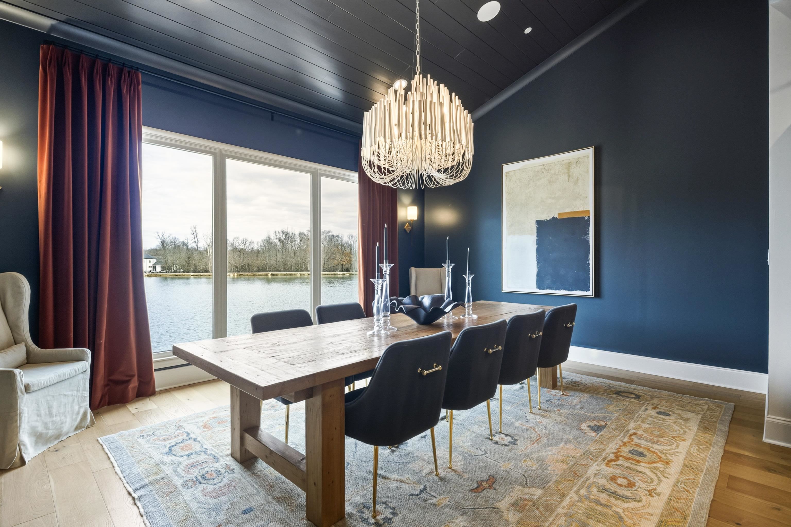 160 North Lake Road Piperton, TN 38017 - Photo 30 of 40 Dining area featuring a chandelier, light wood finished floors, lofted ceiling, wooden ceiling, and a water view