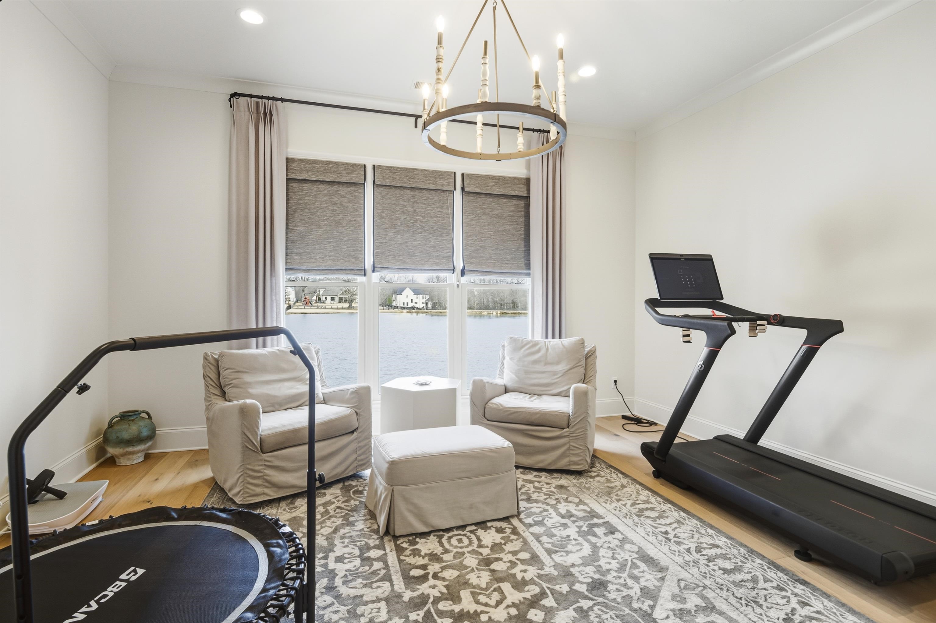 160 North Lake Road Piperton, TN 38017 - Photo 37 of 40 Exercise room featuring wood finished floors, ornamental molding, and a chandelier