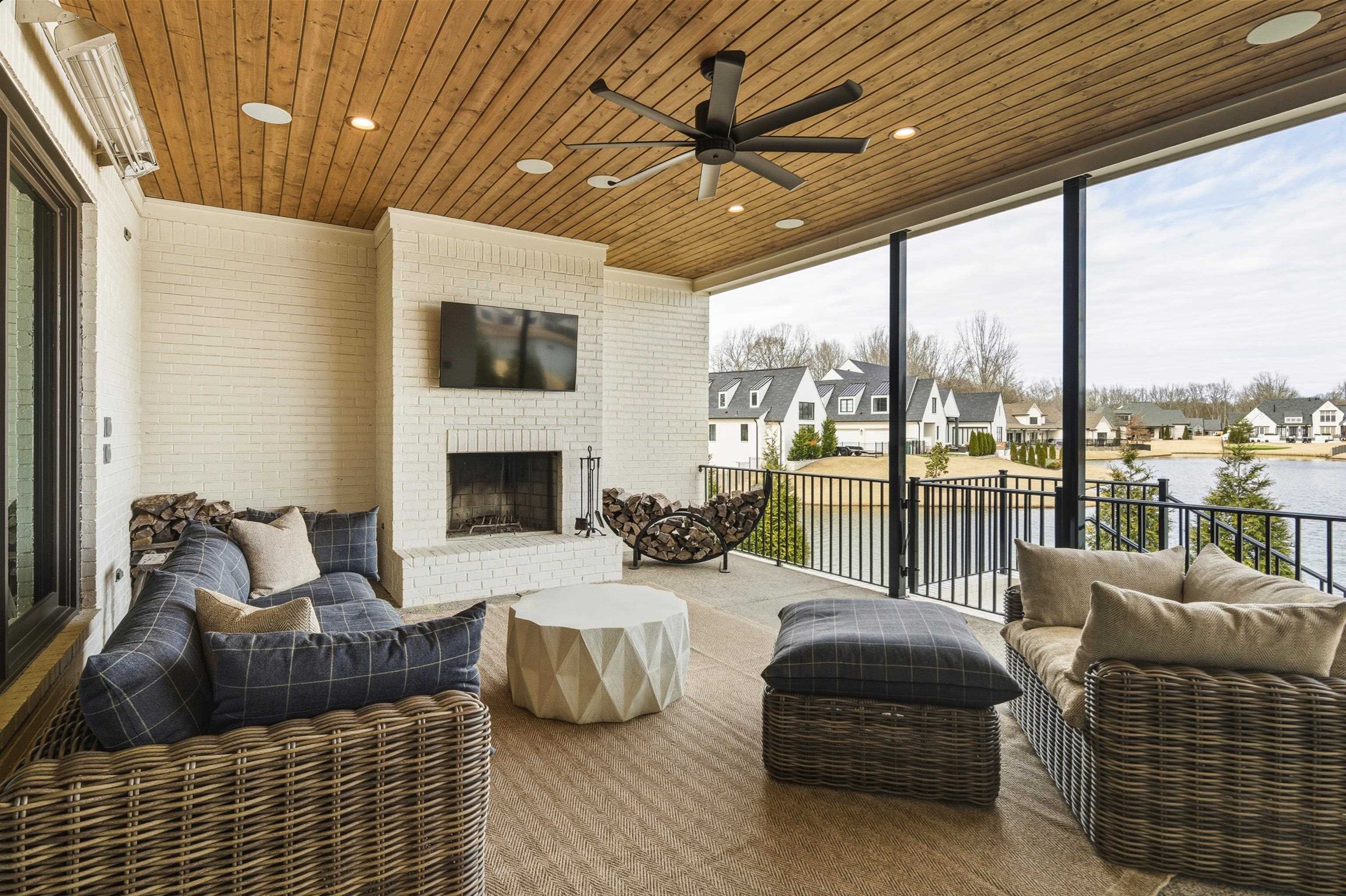 160 North Lake Road Piperton, TN 38017 - Photo 6 of 40 Sunroom / solarium featuring wooden ceiling, a residential view, floor to ceiling windows, recessed lighting, and brick wall