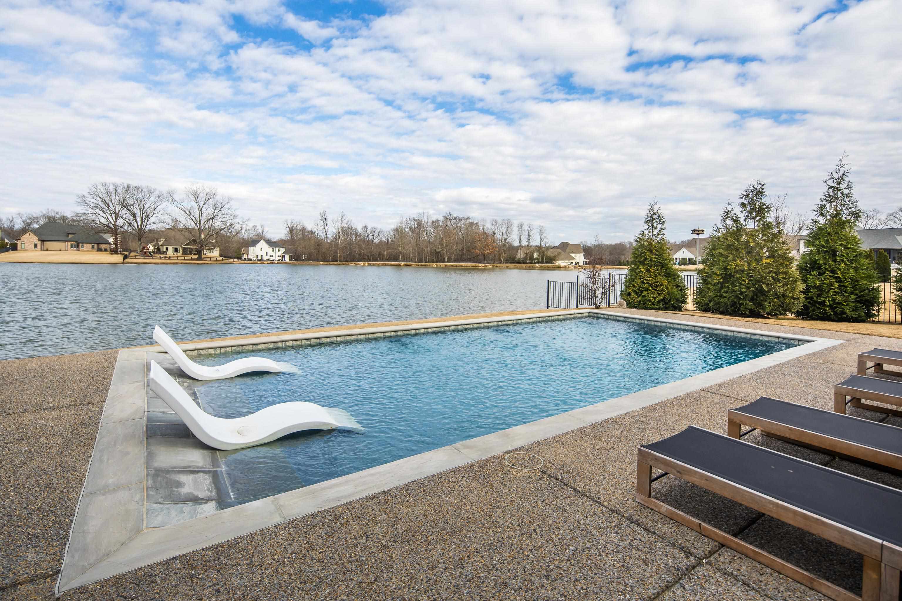 160 North Lake Road Piperton, TN 38017 - Photo 9 of 40 Outdoor pool featuring a water view, a residential view, and a patio area