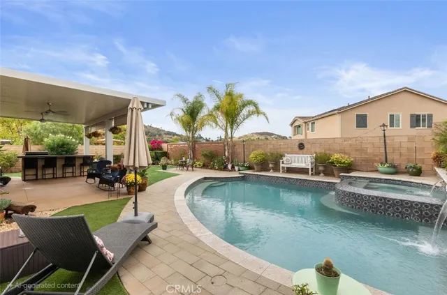 a view of a swimming pool with a lounge chairs