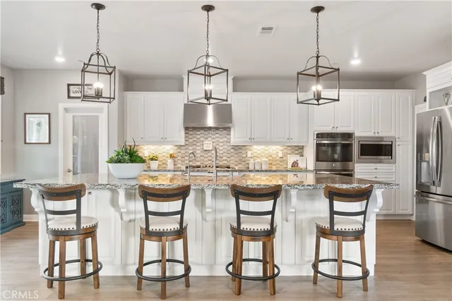 a view of kitchen and dining area with furniture