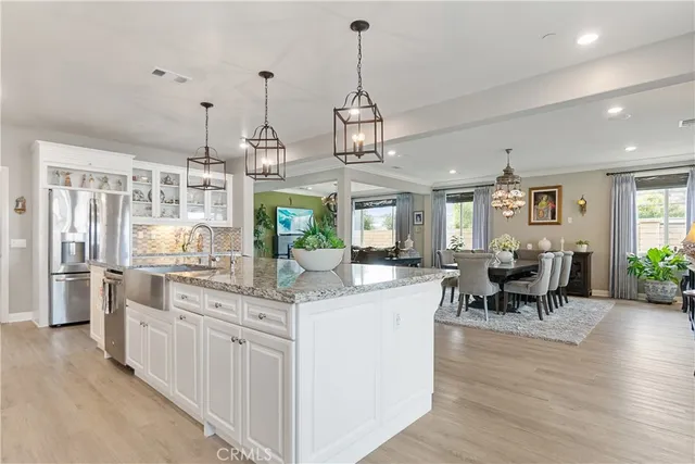 a open kitchen with stainless steel appliances granite countertop a stove and cabinets