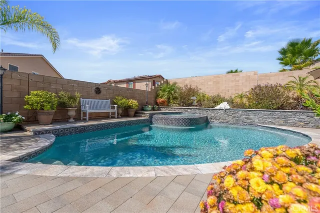 a view of a garden with a building in the background