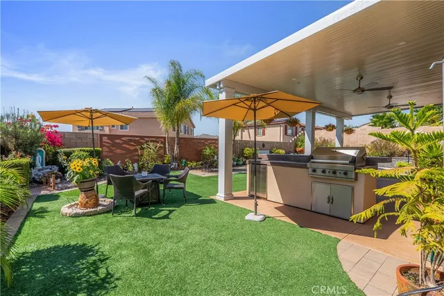 a view of a backyard with plants and a patio