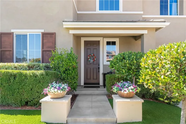 a front view of a house having outdoor seating