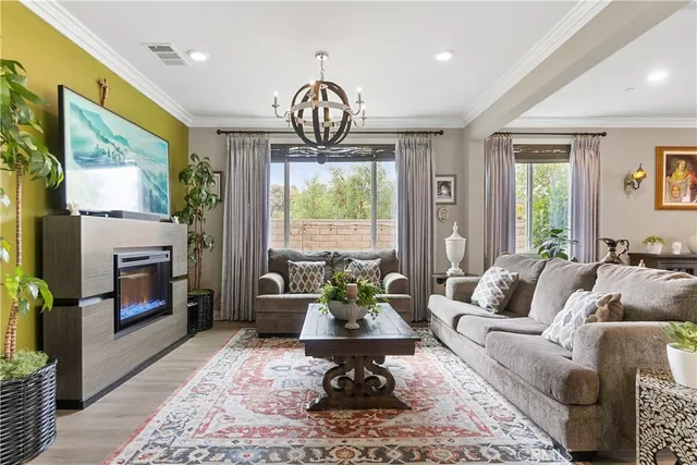 a living room with furniture fireplace and window