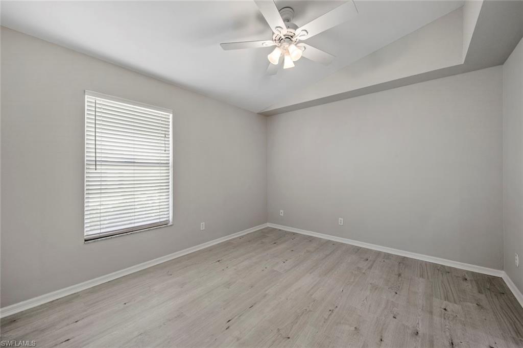 21629 Windham Run Estero, FL 33928 - Photo 18 of 48 an empty room with a window and a fan