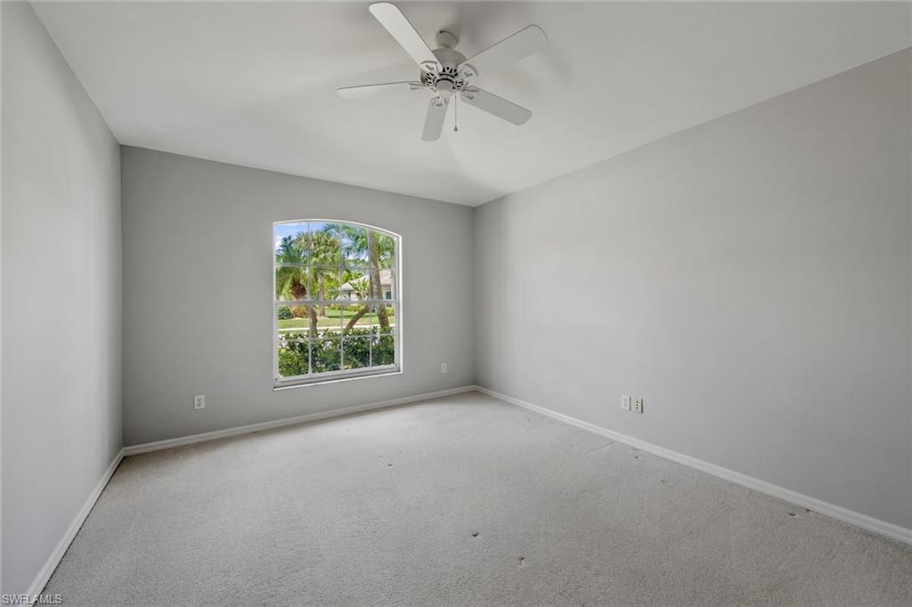 21629 Windham Run Estero, FL 33928 - Photo 21 of 48 wooden floor in an empty room with a window