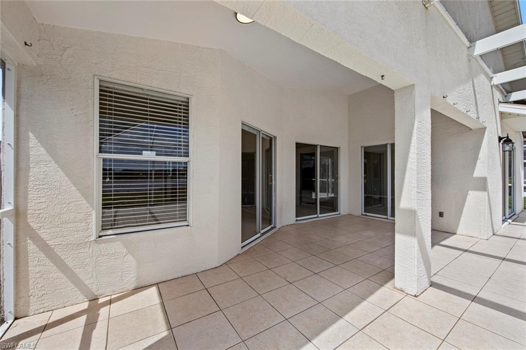 21629 Windham Run Estero, FL 33928 - Photo 26 of 48 a view of an empty room with wooden floor and a window