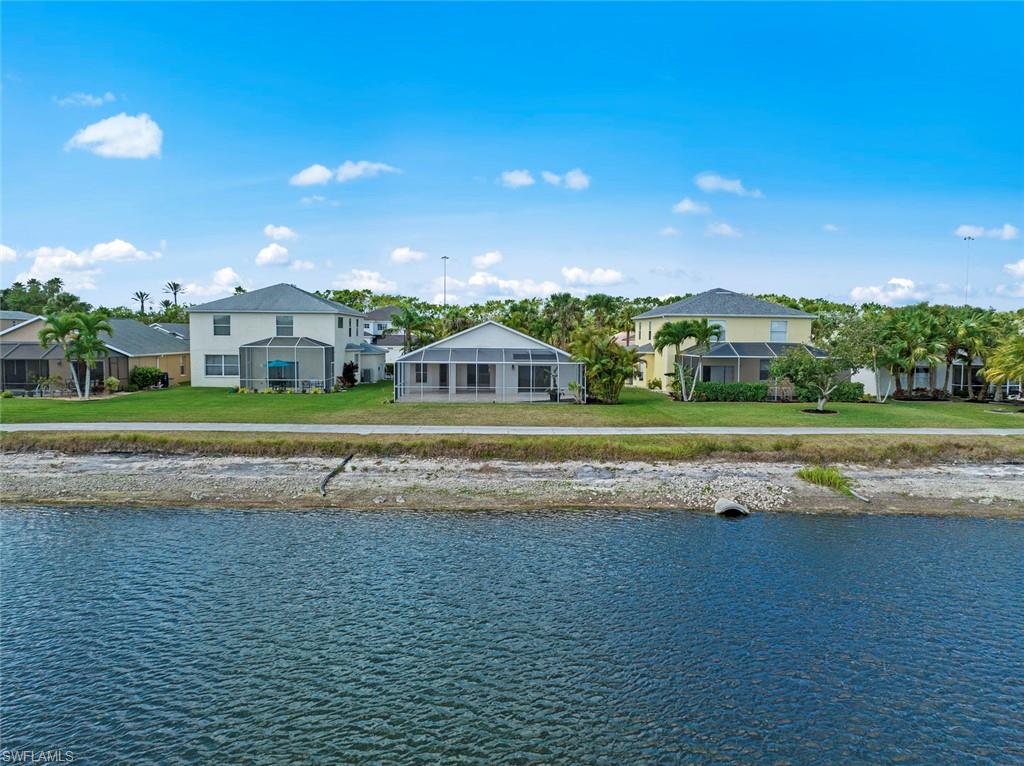 21629 Windham Run Estero, FL 33928 - Photo 29 of 48 a view of houses with outdoor space and swimming pool