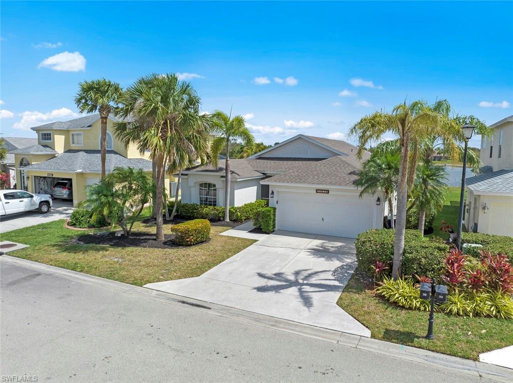 21629 Windham Run Estero, FL 33928 - Photo 32 of 48 a front view of a house with garden