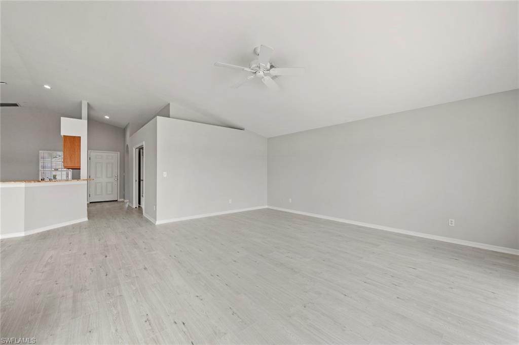 21629 Windham Run Estero, FL 33928 - Photo 6 of 48 a view of a kitchen with a refrigerator and a sink