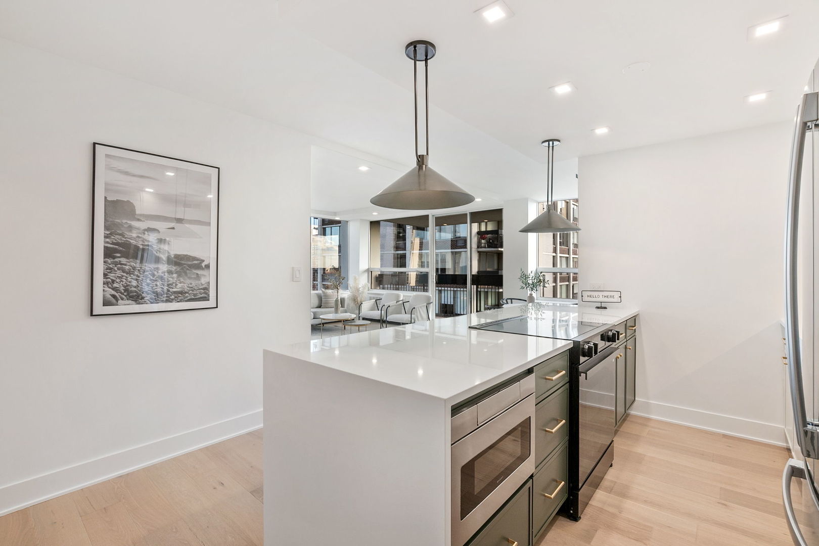 1460 North Sandburg Terrace, Unit 2001A Chicago, IL 60610 - Photo 12 of 39 a kitchen with stainless steel appliances granite countertop a sink a stove a dining table and chairs