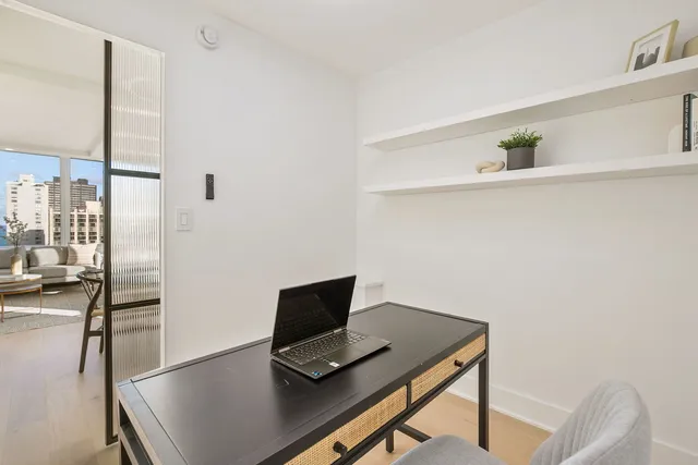 a view of workspace with wooden floor