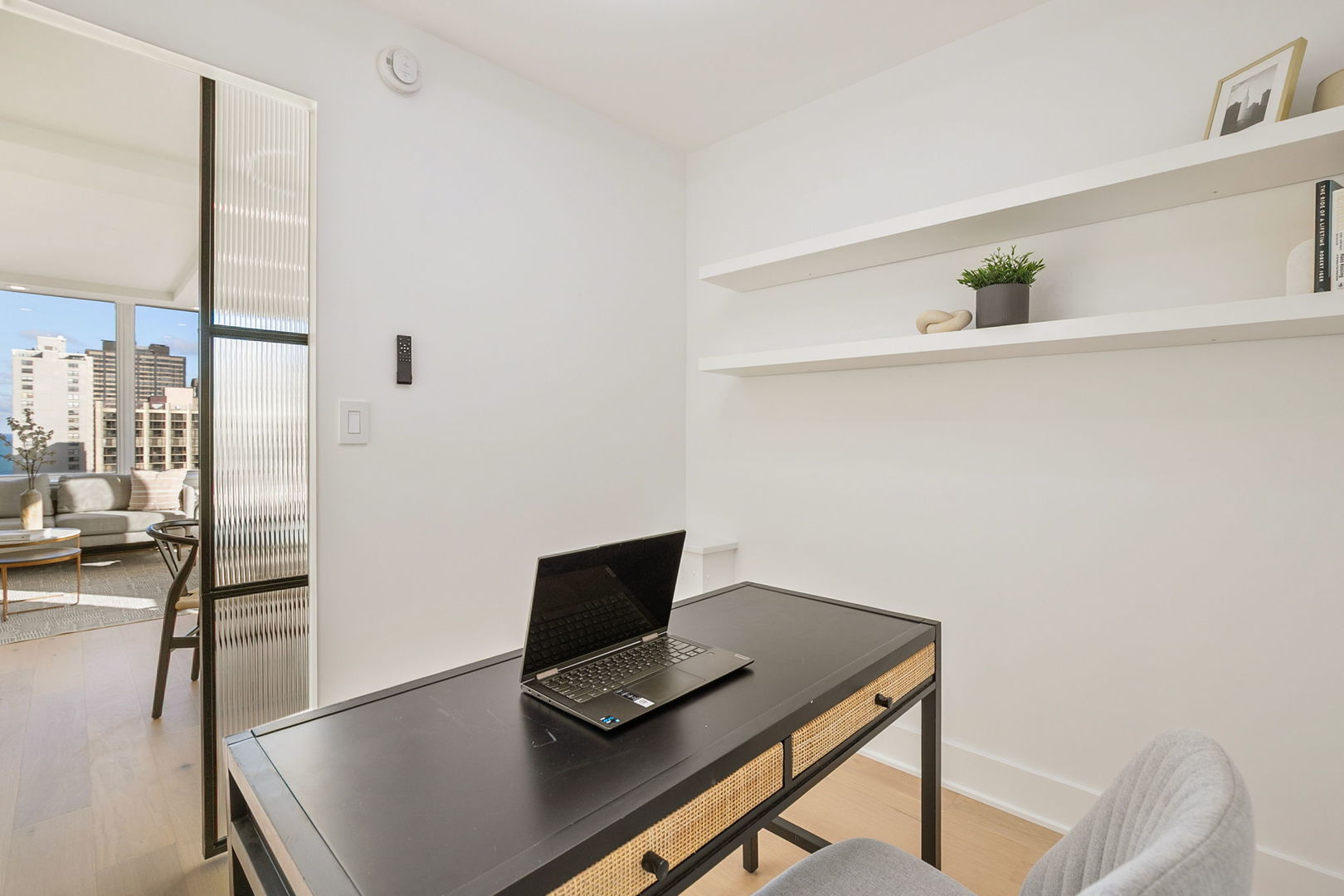 1460 North Sandburg Terrace, Unit 2001A Chicago, IL 60610 - Photo 14 of 39 a view of workspace with wooden floor