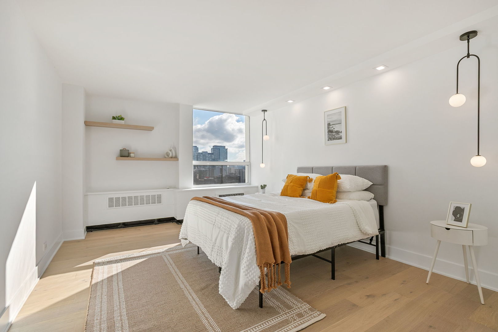 1460 North Sandburg Terrace, Unit 2001A Chicago, IL 60610 - Photo 17 of 39 a bedroom with a bed and a table