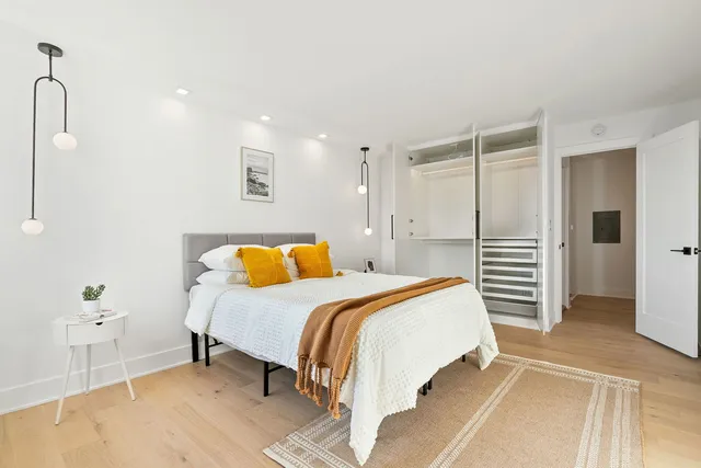 a bedroom with a bed and a table