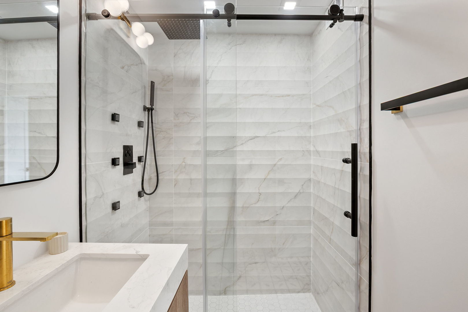 1460 North Sandburg Terrace, Unit 2001A Chicago, IL 60610 - Photo 21 of 39 a bathroom with a granite countertop shower sink and vanity