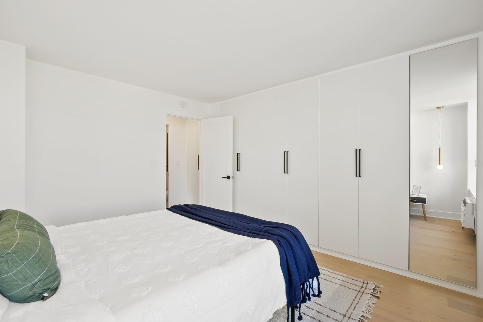 1460 North Sandburg Terrace, Unit 2001A Chicago, IL 60610 - Photo 23 of 39 a bedroom with a bed and hallway