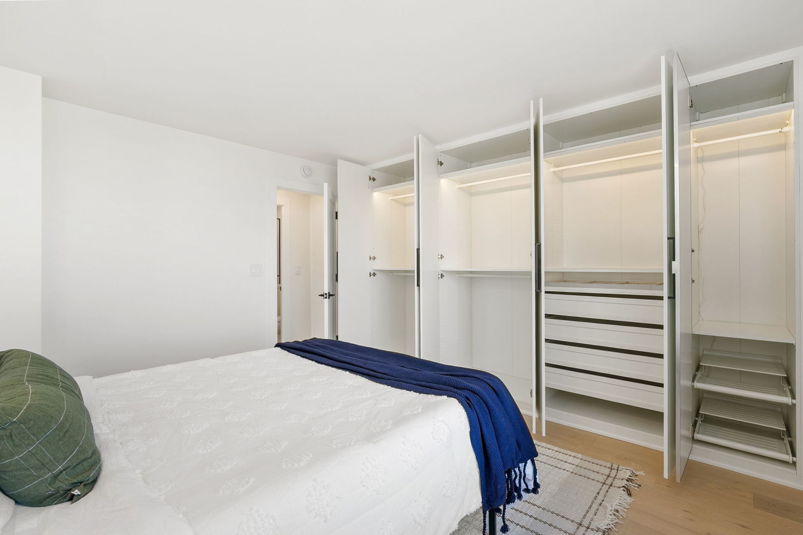 1460 North Sandburg Terrace, Unit 2001A Chicago, IL 60610 - Photo 24 of 39 a bedroom with a bed and a walk in closet