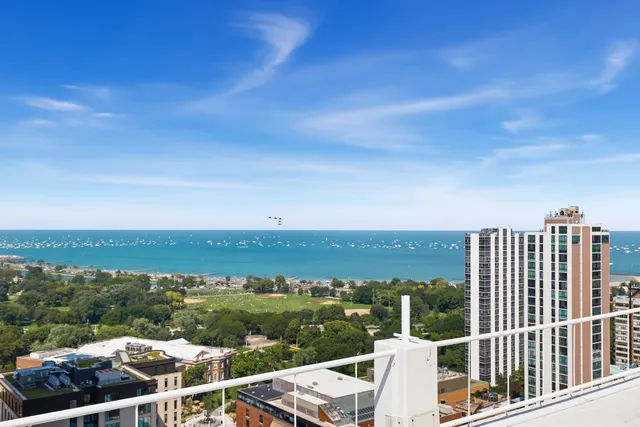 an aerial view of a city view and lake view