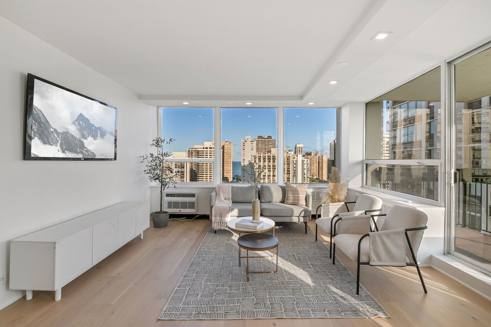 1460 North Sandburg Terrace, Unit 2001A Chicago, IL 60610 - Photo 3 of 39 a living room with furniture and a large window