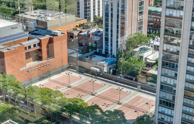 an aerial view of residential house with outdoor space and swimming pool