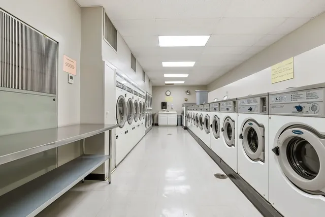 a view of a hallway with washer and dryer