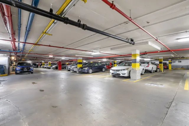 a lobby with furniture and floor to ceiling window