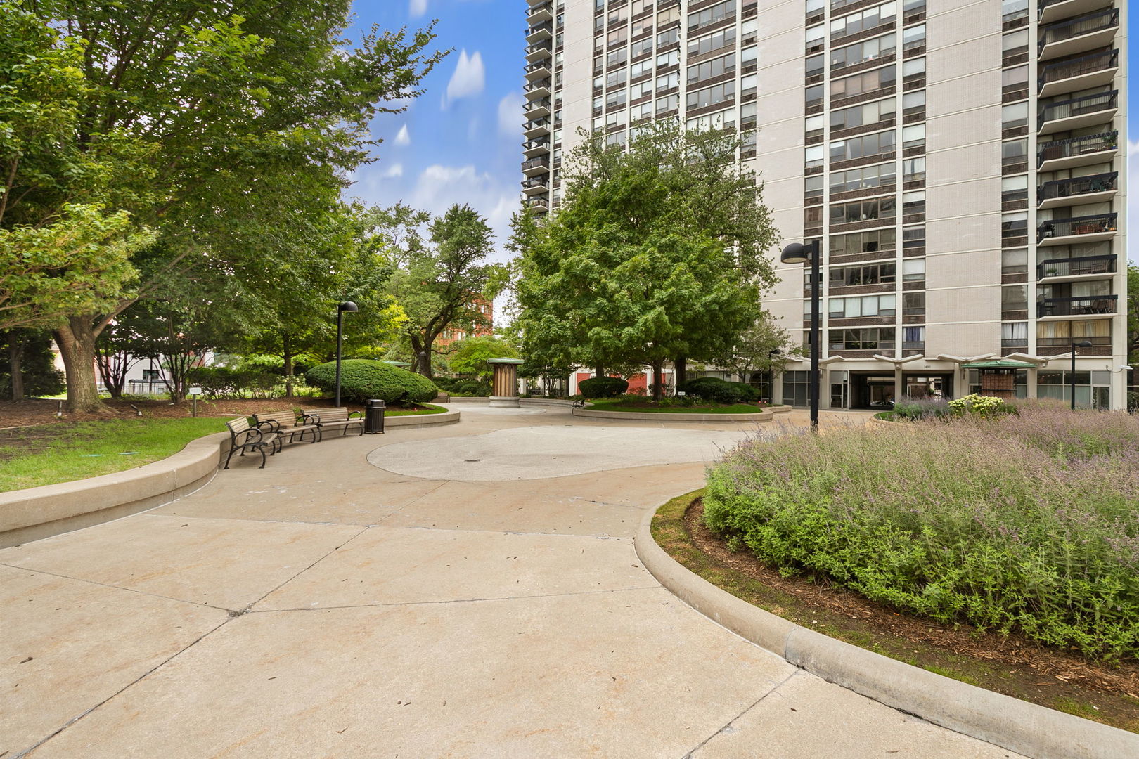 1460 North Sandburg Terrace, Unit 2001A Chicago, IL 60610 - Photo 38 of 39 a view of swimming pool with outdoor seating and plants